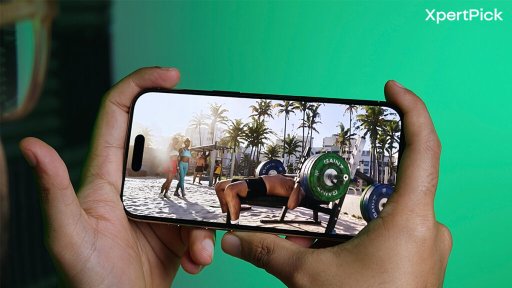 Apple iPhone Air held in landscape orientation while playing a video, showcasing the OLED display and slim bezels against a green background (Yetnesh Dubey / XpertPick)