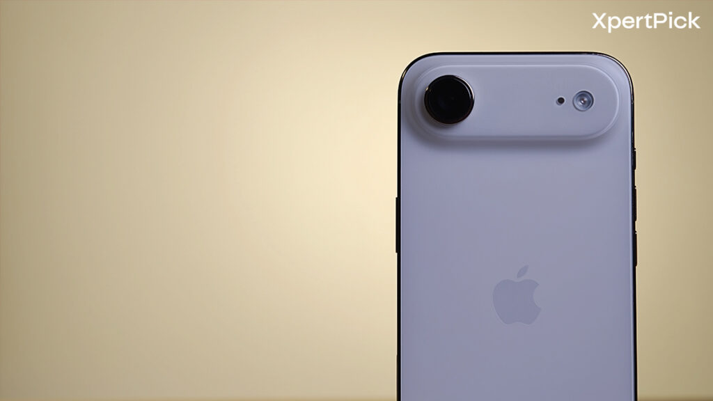 Close-up of the Apple iPhone Air’s rear camera bar and Apple logo, highlighting the single-camera design against a soft yellow background. (Yetnesh Dubey / XpertPick)