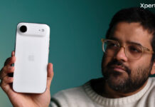 Apple iPhone Air Review: Apple’s Thinnest iPhone Comes With the Thickest Trade-Offs Rear view of the Apple iPhone Air in white, showing the horizontal camera bar design, held in hand against a teal background (Source: Yetnesh Dubey / XpertPick)